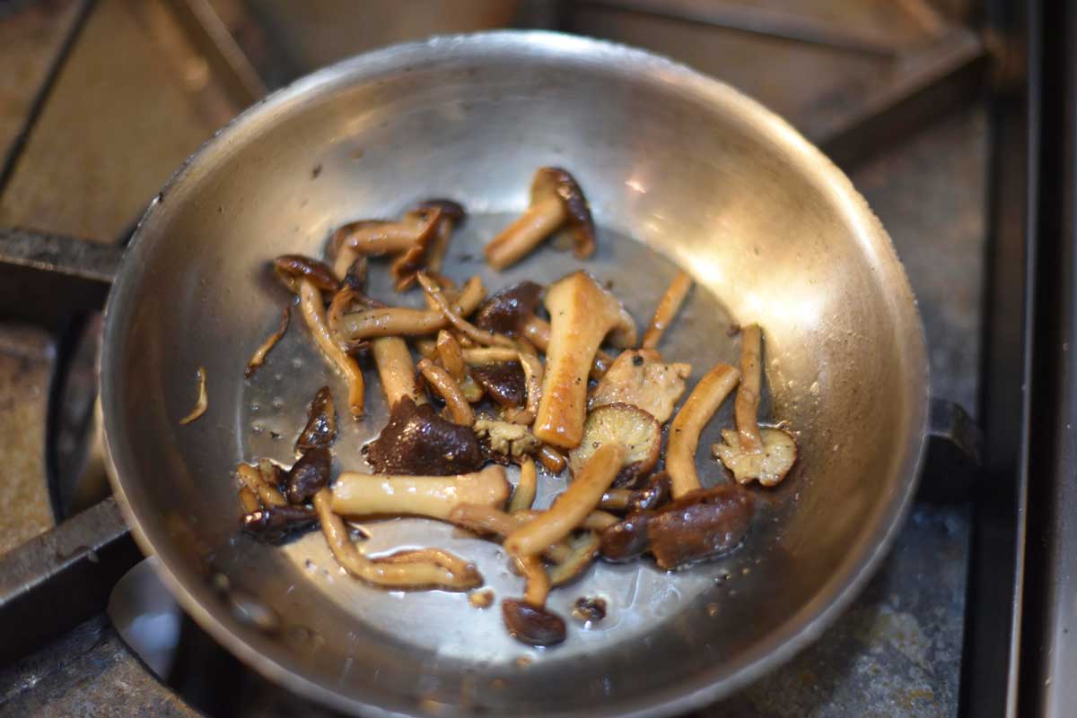 Mushrooms sizzle on the stove at 1300 