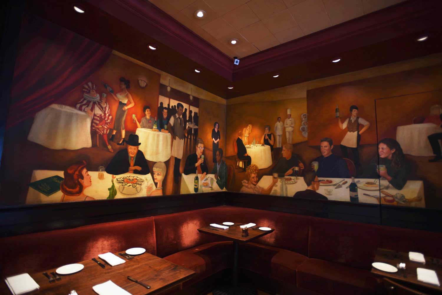 Murals of joyful diners decorate the Absinthe dining area