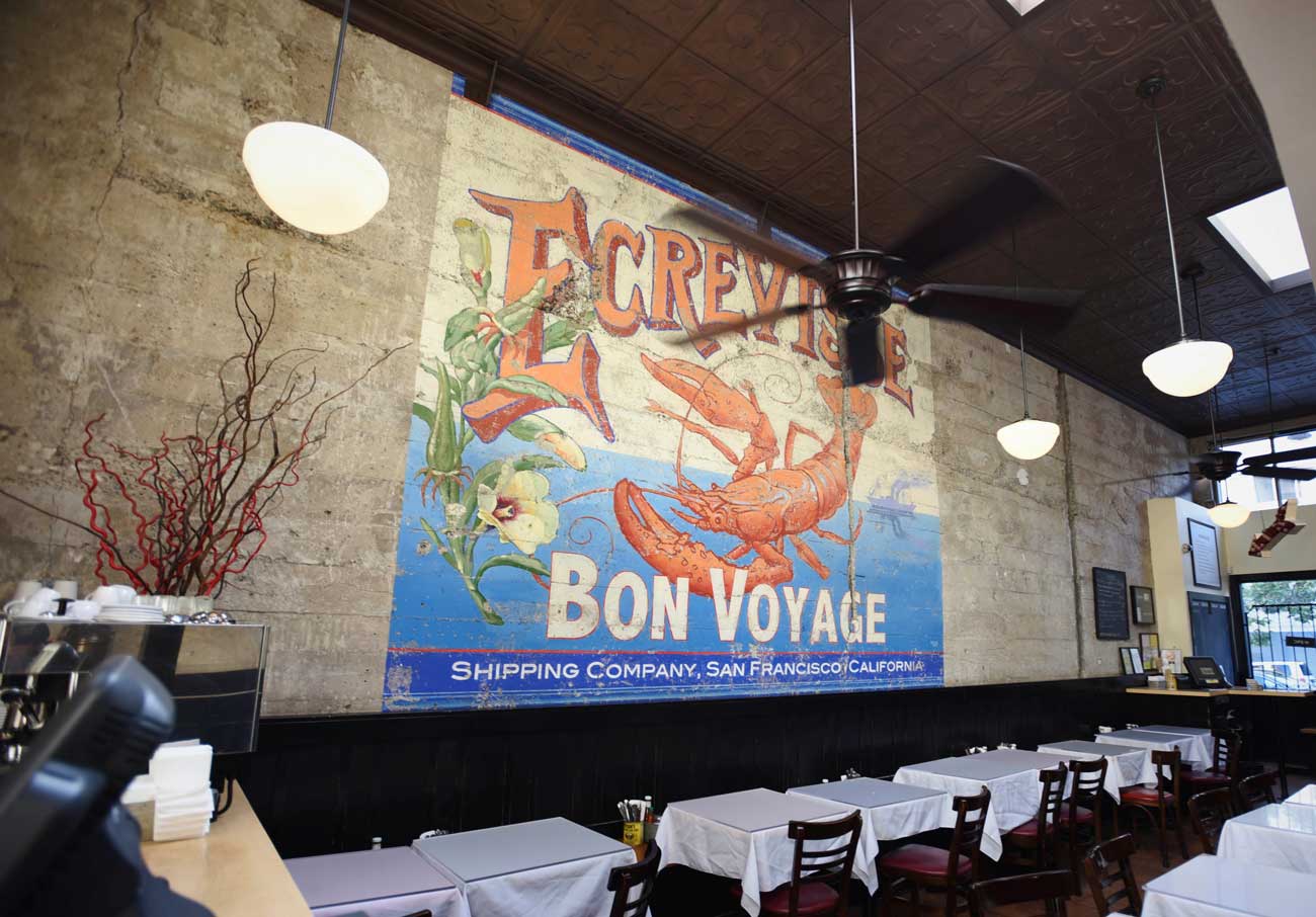 The mural at Brenda's stretches to the ceiling and was designed by Chef Brenda, a trained artist