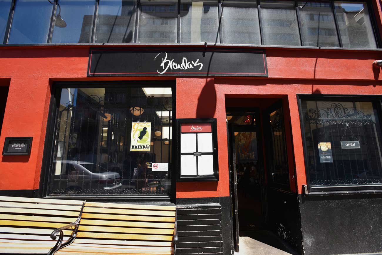 The bright exterior of Brenda's French Soul Food stands out in the Tenderloin