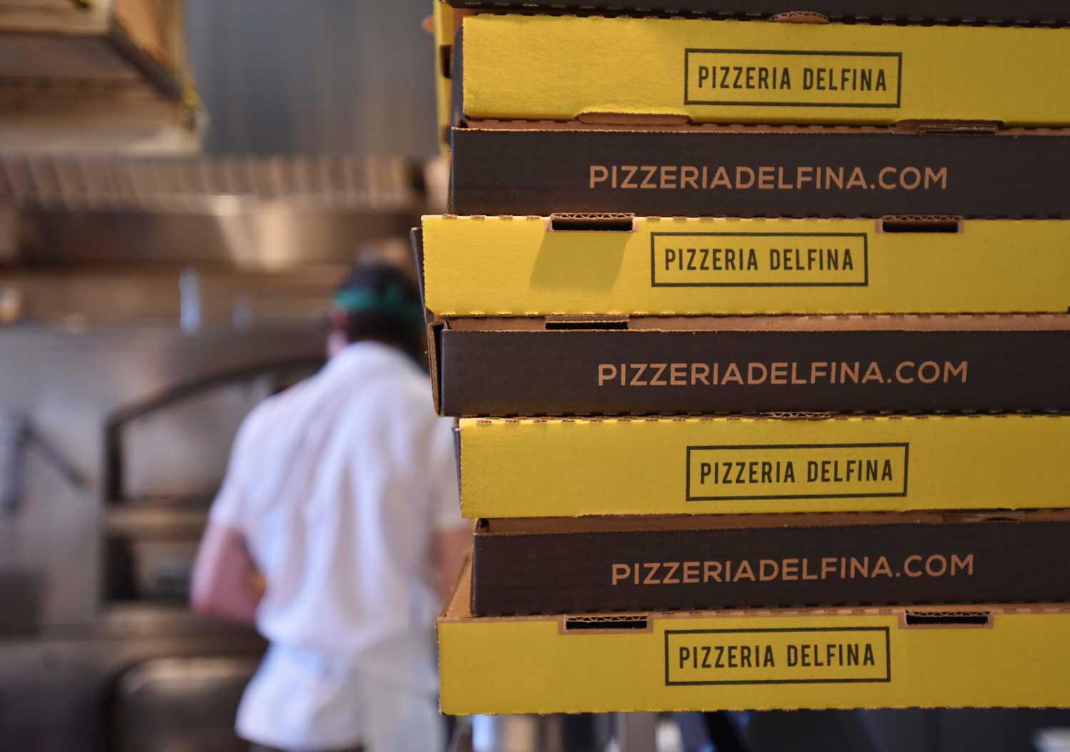 Pizzeria Delfina works with delivery services like Postmates to make it easy to order their pizza for delivery
