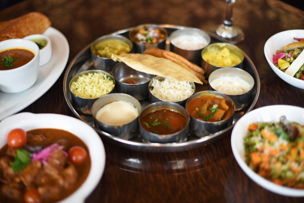Beautiful, colorful plates for sharing highlight the style of South Indian food at Dosa 