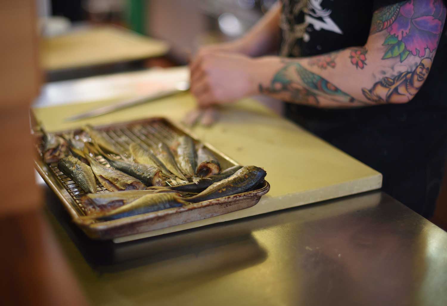 Chef Sara Hauman prepares fish for smoking for Sunday brunch.