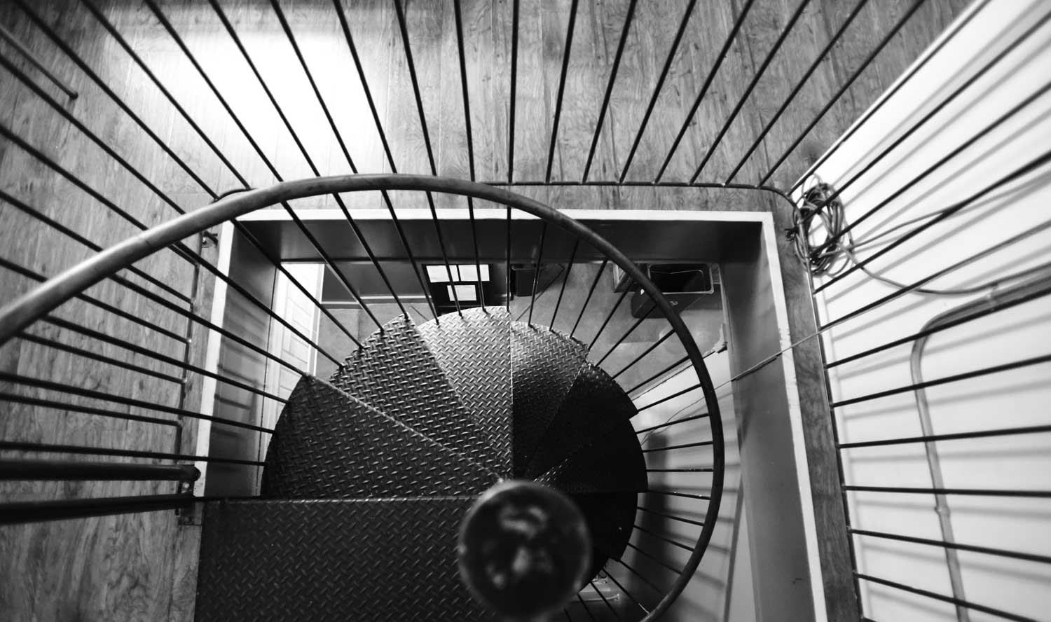 The spiral staircase at Huxley connects the office with the kitchen.