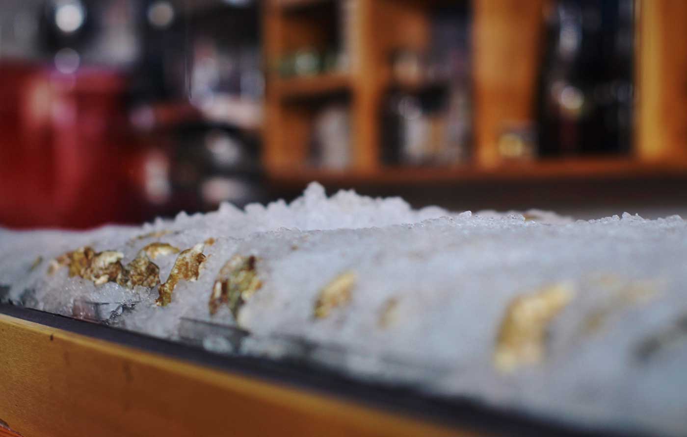 Oysters chill in crushed ice, waiting for customers