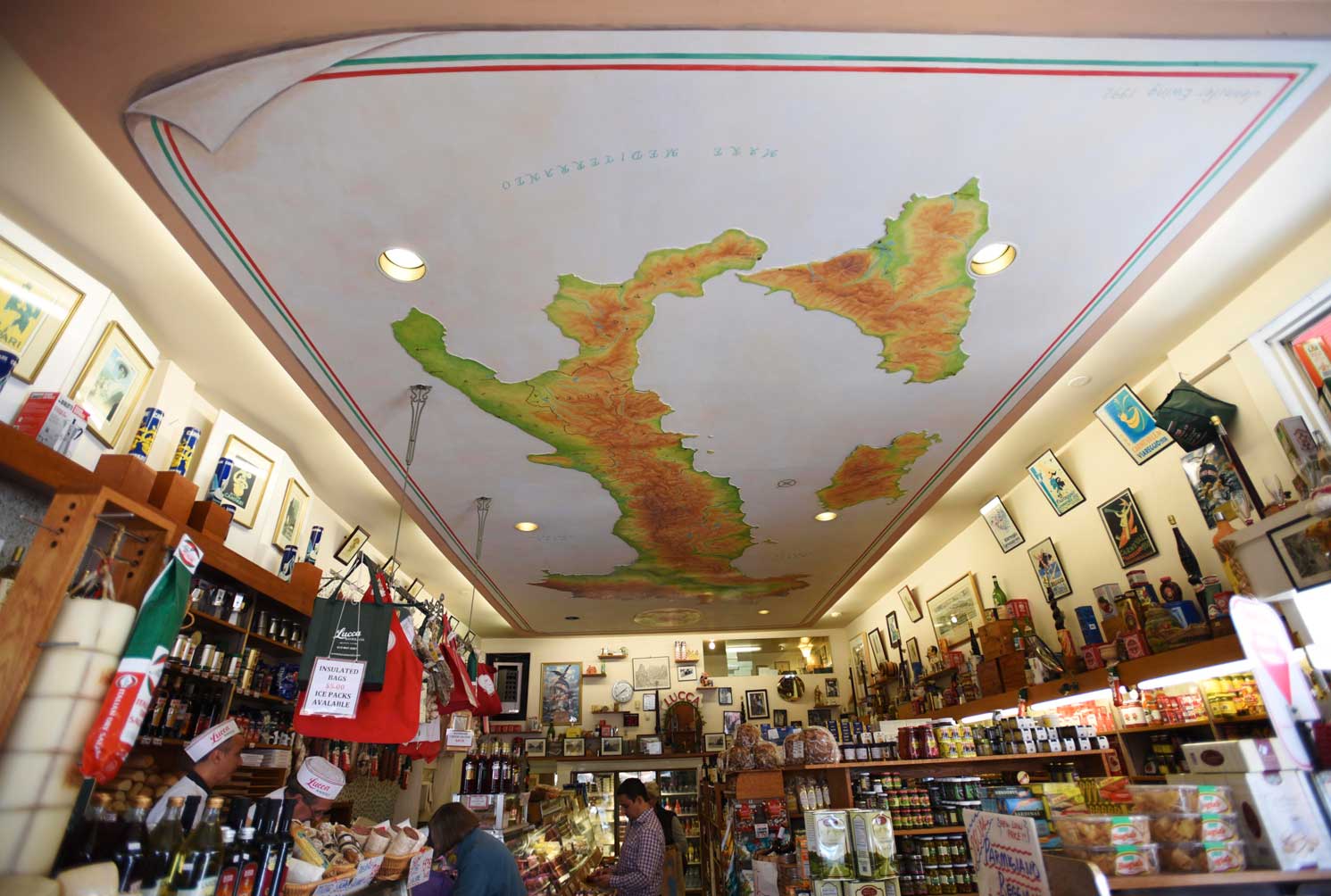 The mural on the ceiling welcomes you into the shop