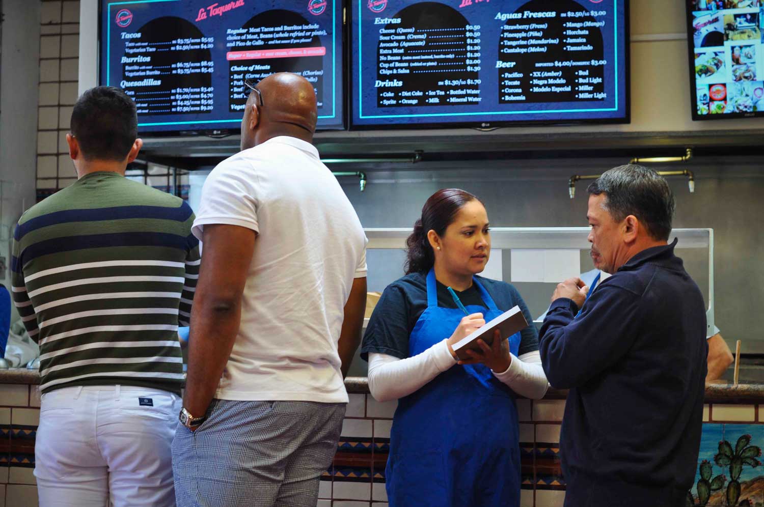 To speed things up, a La Taqueria staff member writes orders