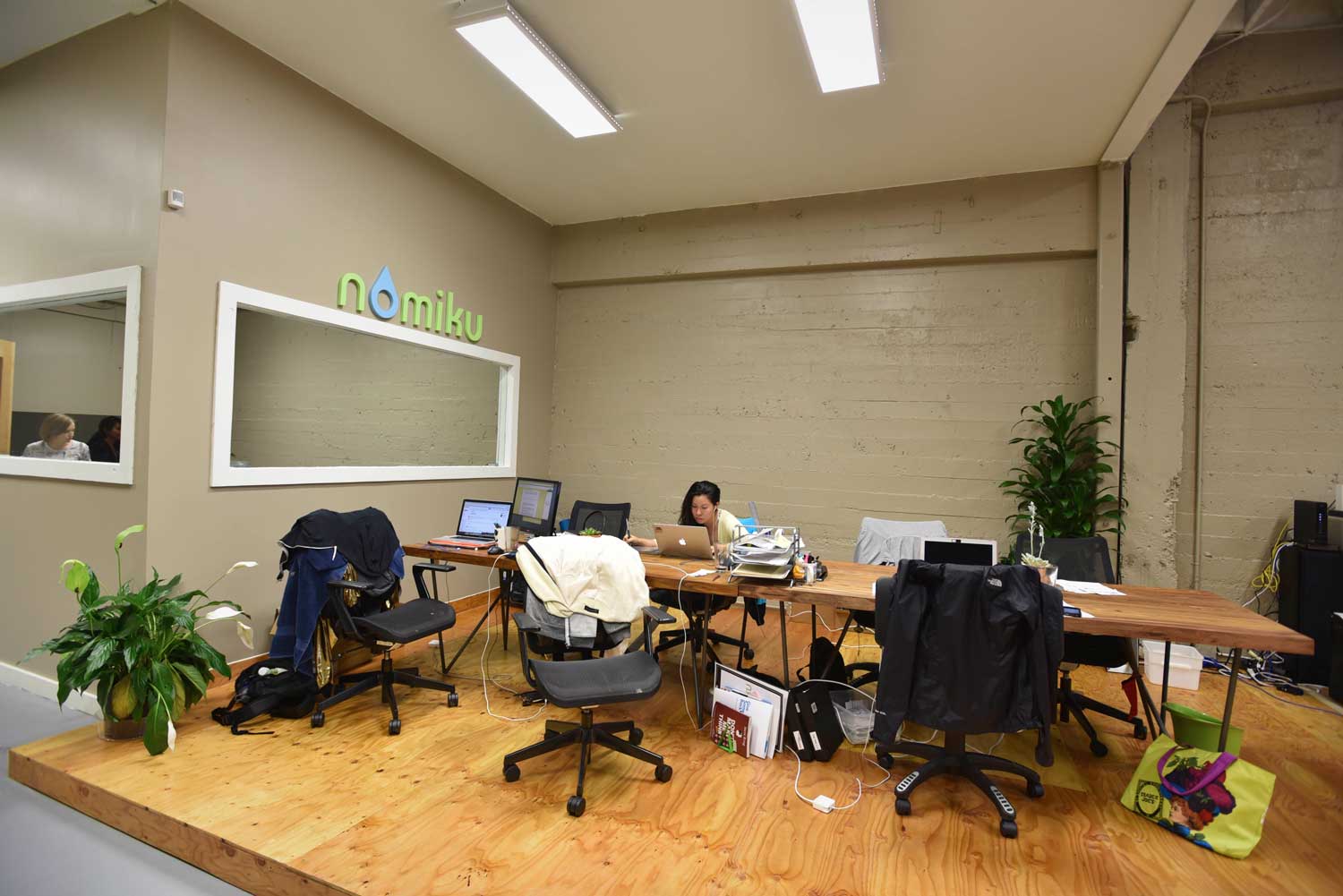 The small but mighty Nomiku team at work in their bright and airy industrial office