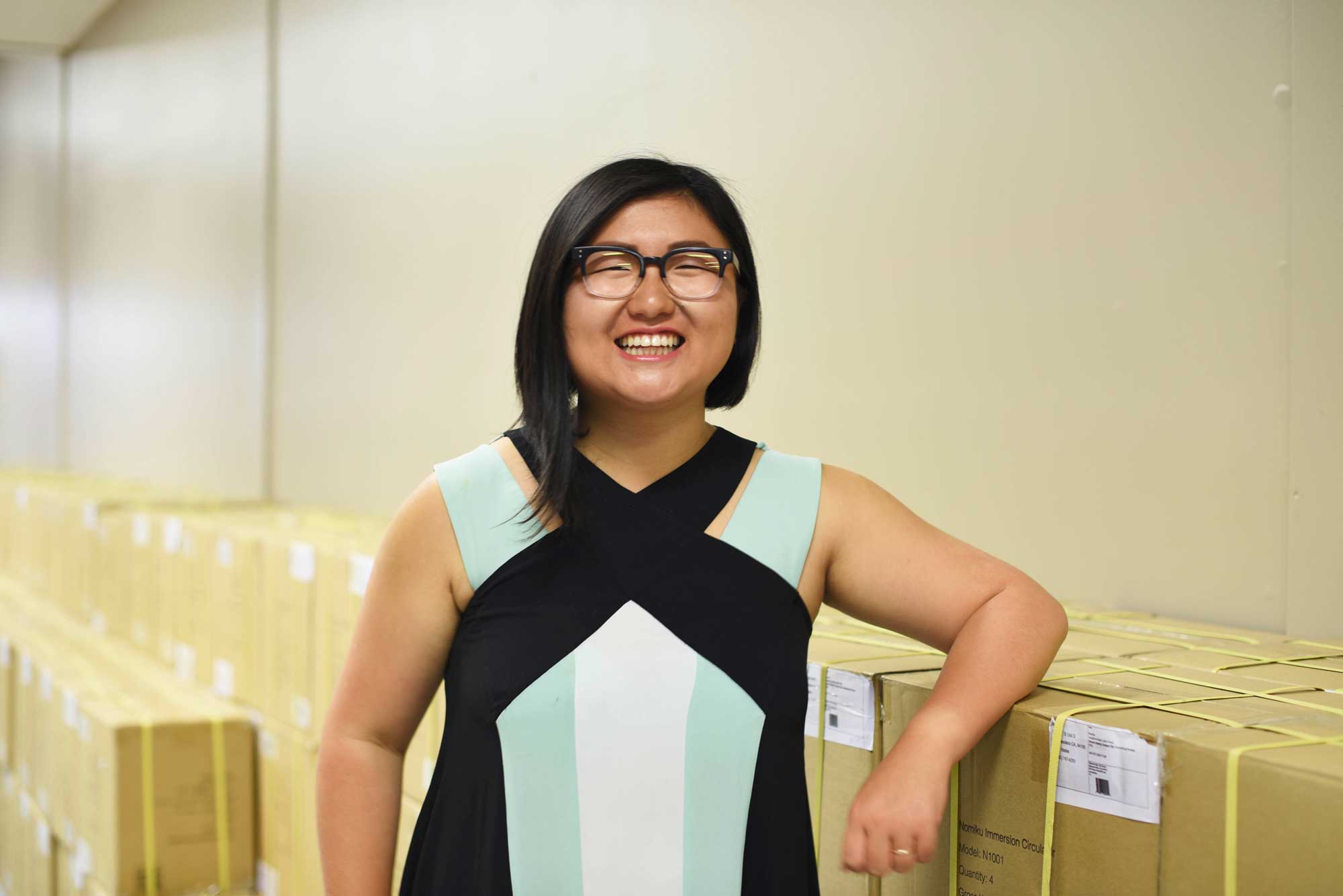 A smiling Fetterman rests on the hundreds of Nomikus ready for shipping