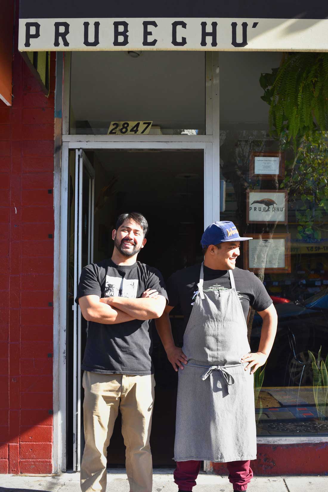 Chef Shawn Naputi and Shawn Camacho stand in front of their restaurant on San Francisco's Mission Street.