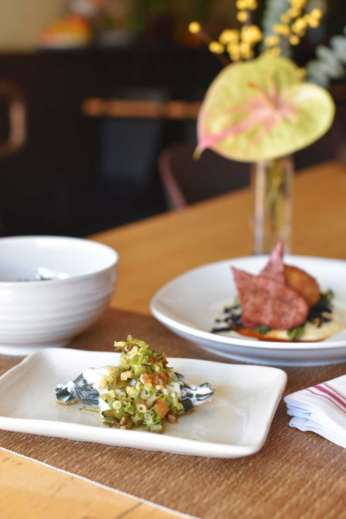 Tropical flowers decorate the tables at Prubechu.