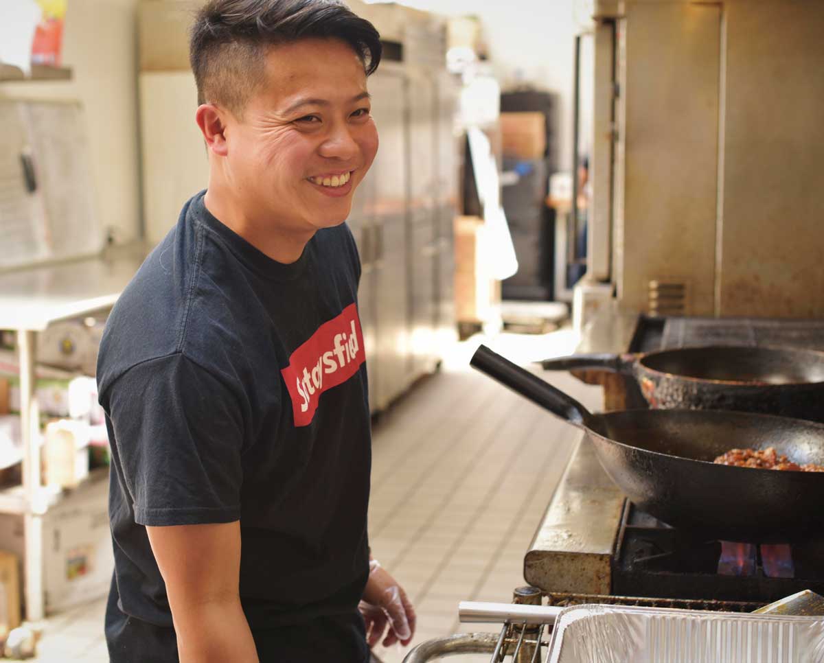 Feldo Nartapura and Ruvi Dayao prepare food in their commercial kitchen, before a catering event.