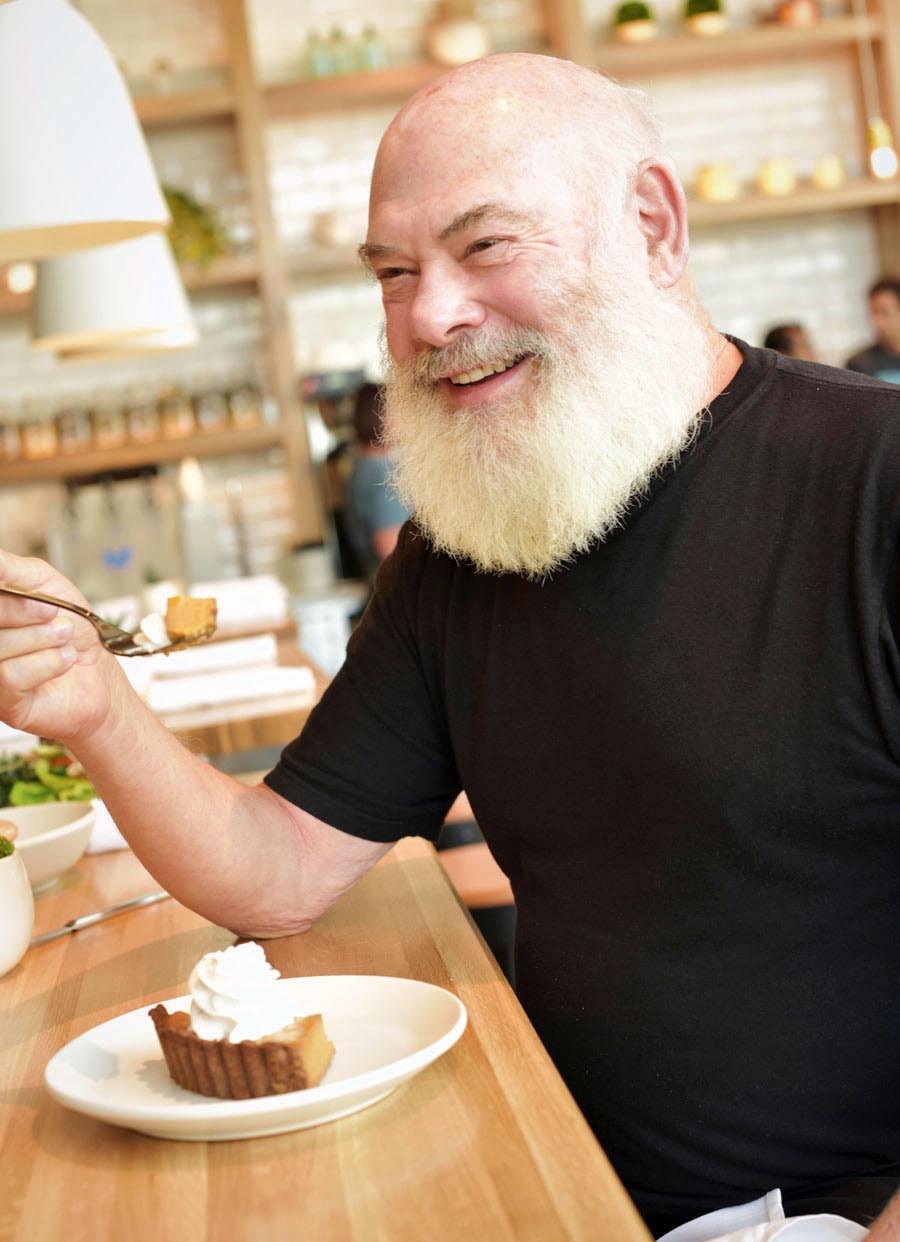 Dr. Andrew Weil enjoys a freshly prepared squash autumn pie, topped with coconut cream 