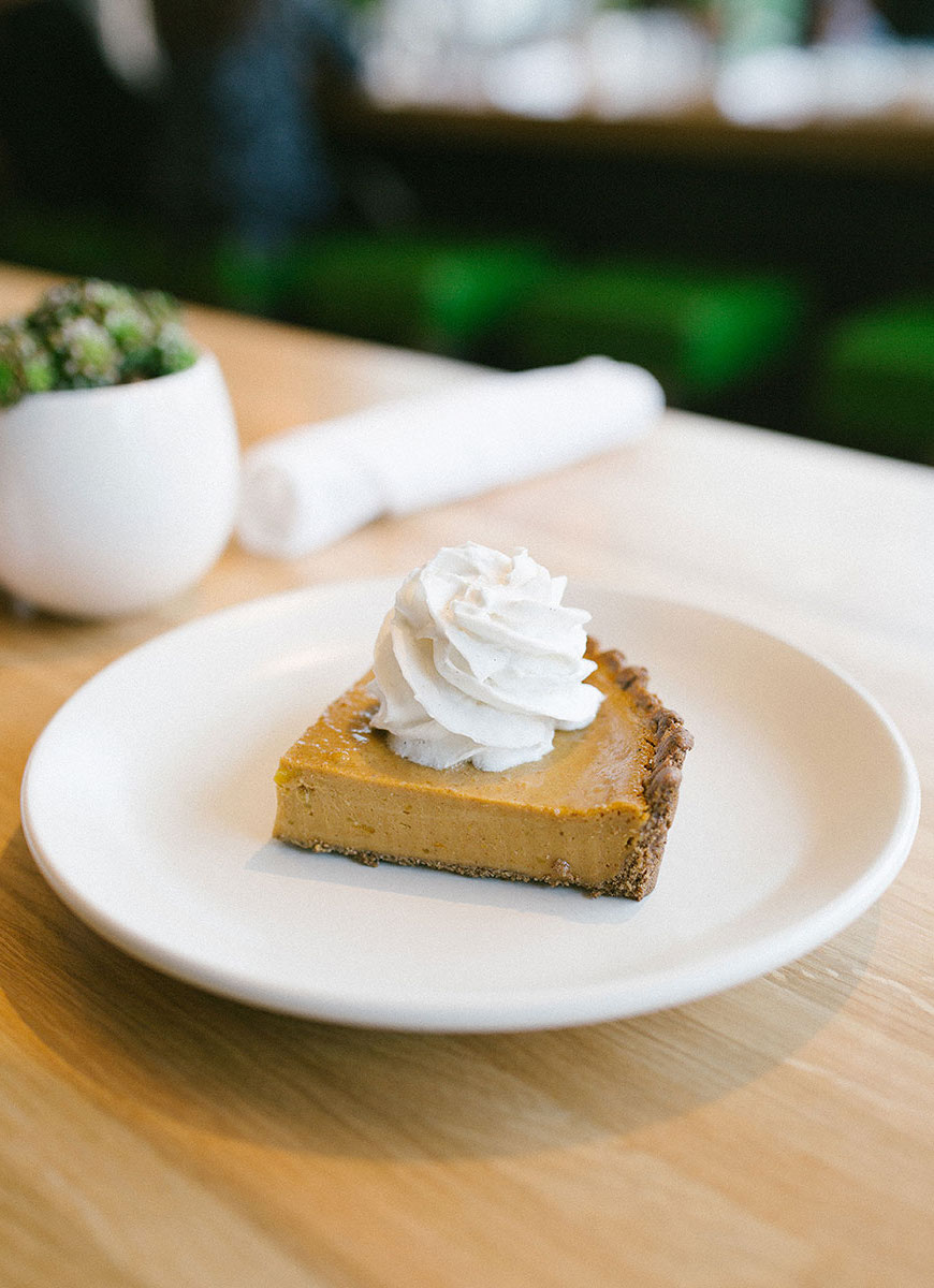An excellent pumpkin pie doesn't have to include any pumpkin at all. This piece of pie is created with butternut squash, vegan graham cracker crust, and coconut cream to top it all off.