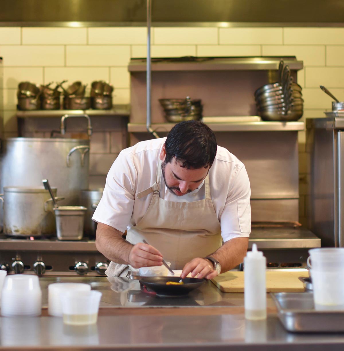 Chef Mark Liberman focuses on plating a dish 