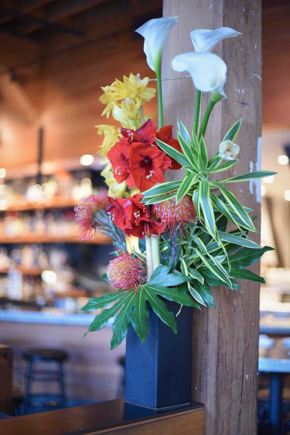 Fresh, bright flowers greet customers as they enter Boxing Room