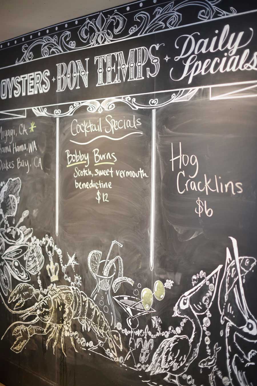 The black chalkboard menu at Boxing Room lists the daily specials