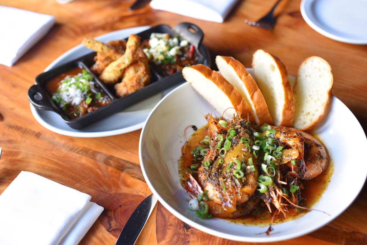 Barbecue shrimp and fried frog legs are among the most popular quintessential New Orleans plates at Boxing Room