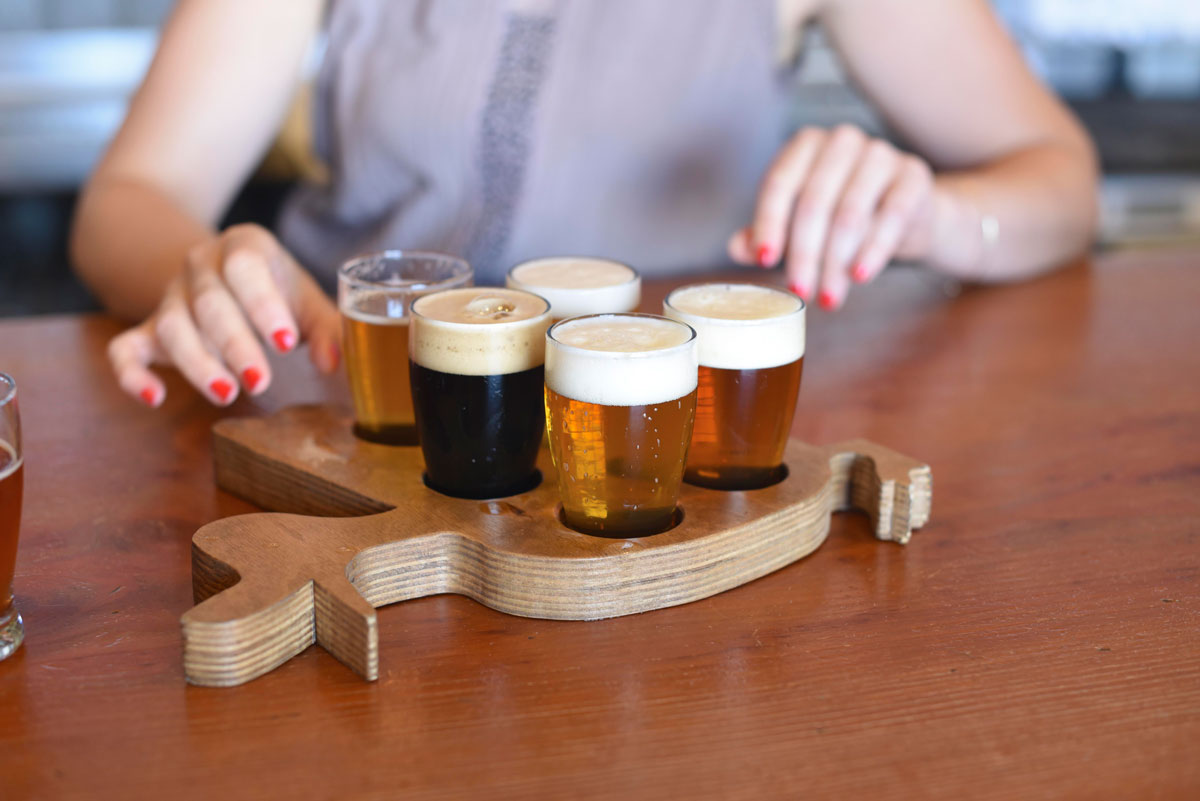 A flight of beers for tasting is served 