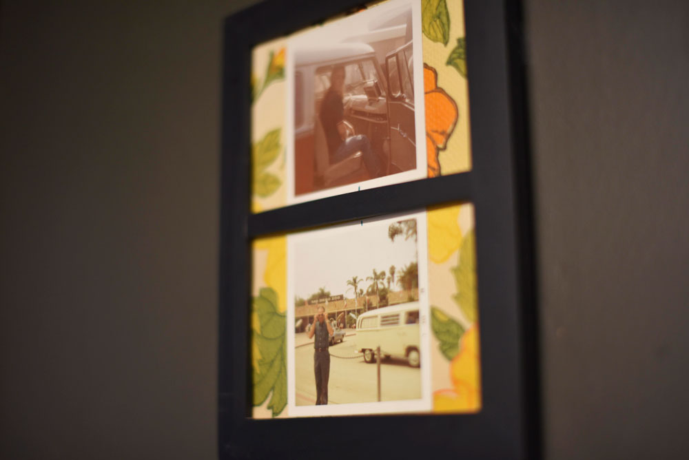 Old family photos surrounding the Volkswagen bus adorn the interior