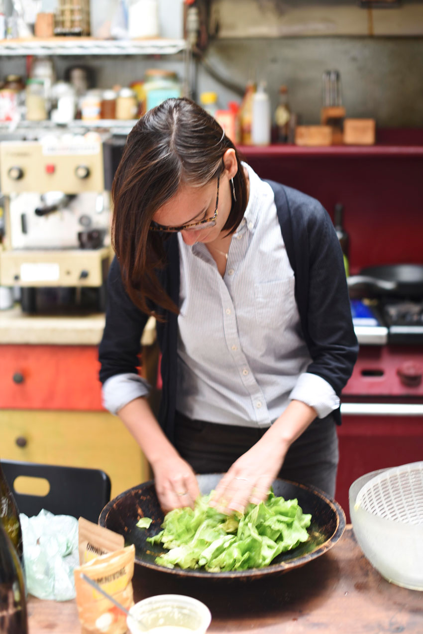 Veronica Ronchi mixes a fresh green salad at the Renaissance Forge, the home of Omnivore Salt