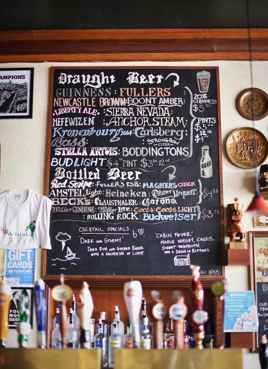The chalk menu at the Pig and Whistle carefully draws out all of the beers available at the pub.