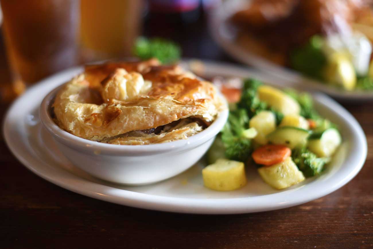 The flaky pastry crust of the Steak and Mushroom Pie makes this dish from the Pig and Whistle another favorite.