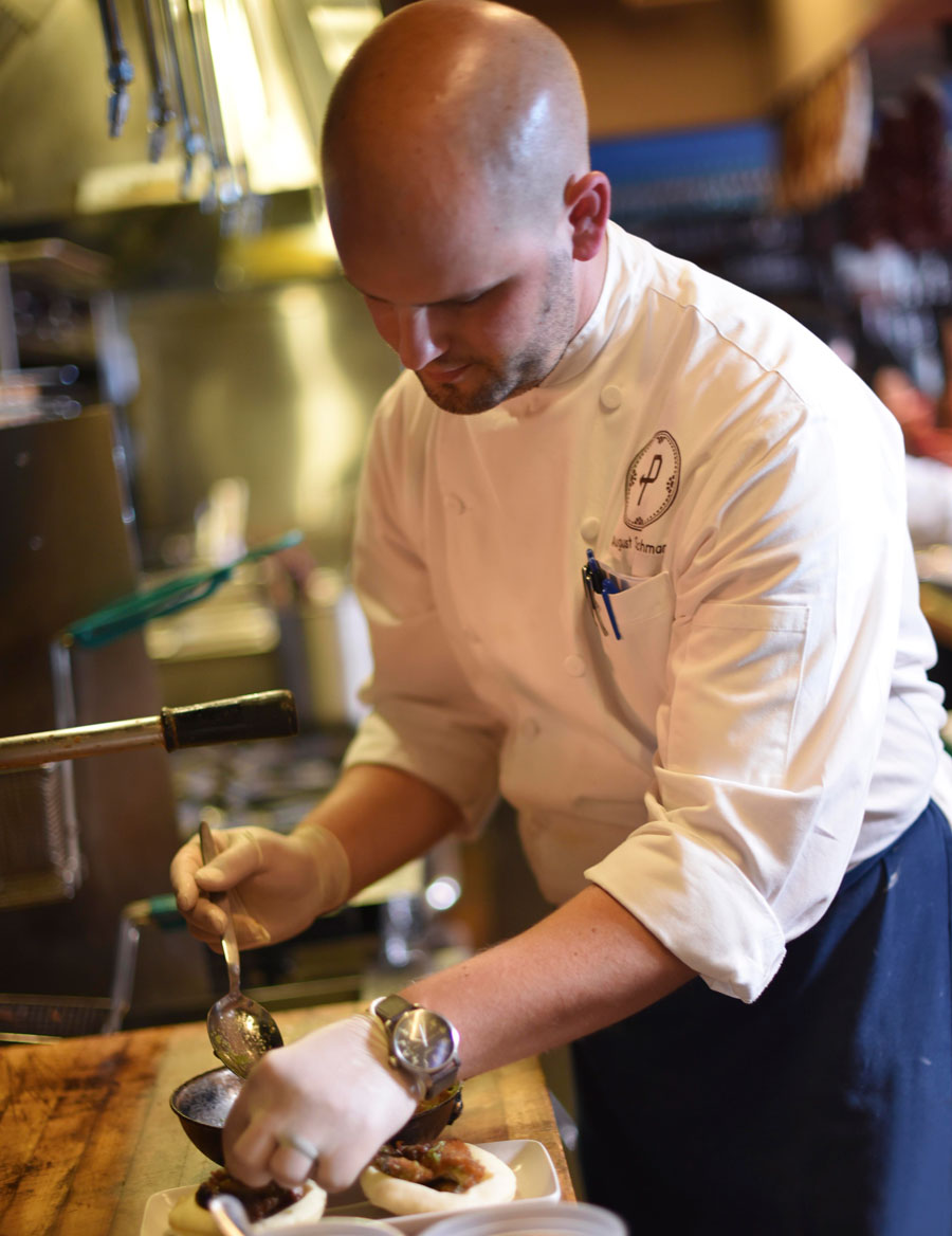 Chef August Schuchman puts the finishing touches on a fresh plate 