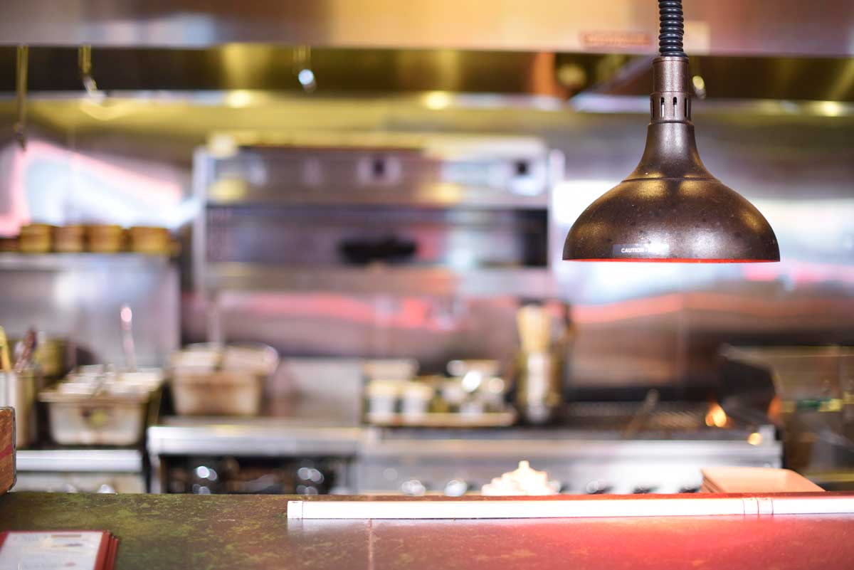 Heat lamps keep food warm in the kitchen 