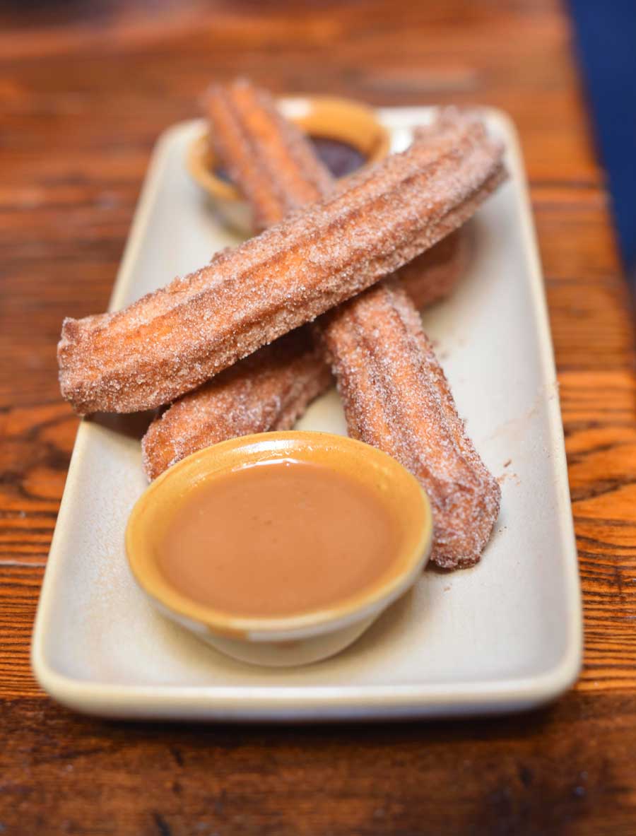 Churros with caramel and chocolate dipping sauce 